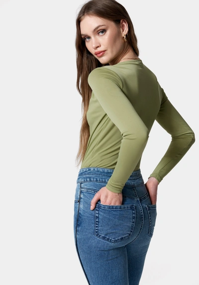 Shop Bebe Wrap Front Knit Bodysuit In Sage