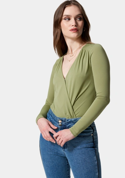 Shop Bebe Wrap Front Knit Bodysuit In Sage