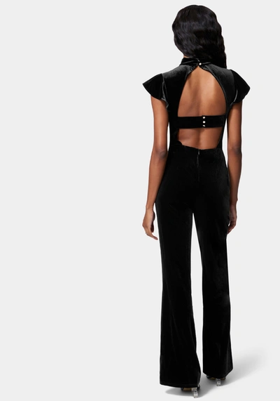 Bebe Ruffle Sleeve Flare Leg Velvet Jumpsuit In Jet Black
