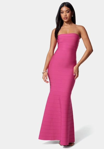 Shop Bebe Luxe Bandage Strapless Gown In Fuchsia