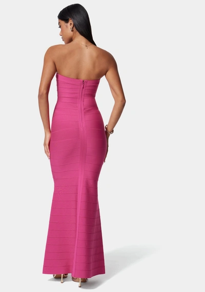Shop Bebe Luxe Bandage Strapless Gown In Fuchsia