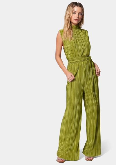 Shop Bebe Knit Plisse Mock Neck Jumpsuit In Golden Cypress