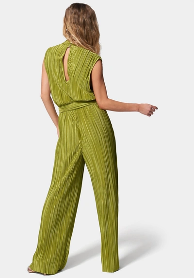 Shop Bebe Knit Plisse Mock Neck Jumpsuit In Golden Cypress