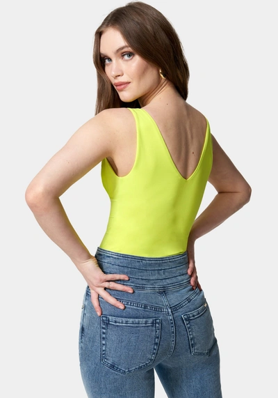 Bebe Sleeveless Ruched Deep V Knit Bodysuit In Cyber Lime
