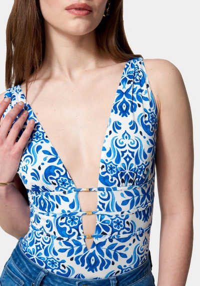 Shop Bebe Sleeveless Ruched Deep V Printed Knit Bodysuit In Mosaic Print