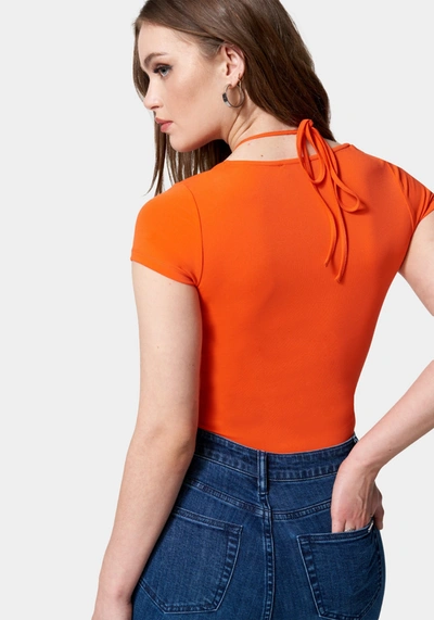 Bebe Short Sleeve Tie Ruched Neck Knit Top In Cherry Tomato
