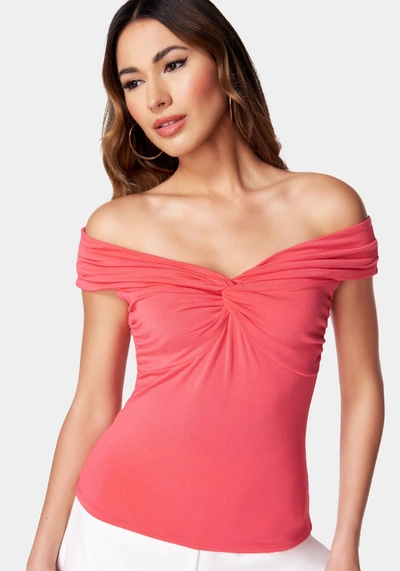 Bebe Off Shoulder Front Twist Draped Top In Geranium