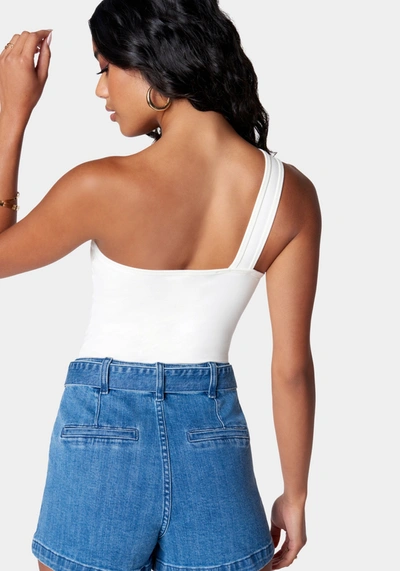 Bebe Cutout Asymmetric One Shoulder Bodysuit In White Alyssum