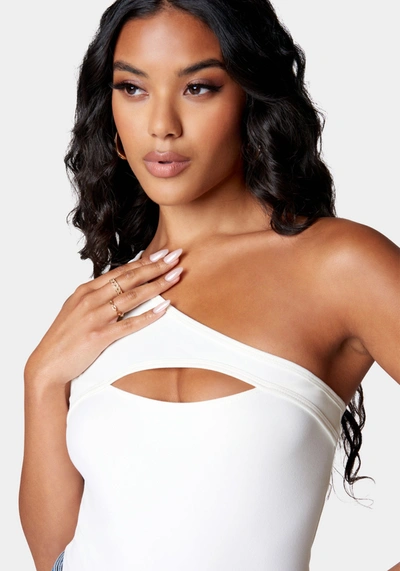 Shop Bebe Cutout Asymmetric One Shoulder Bodysuit In White Alyssum