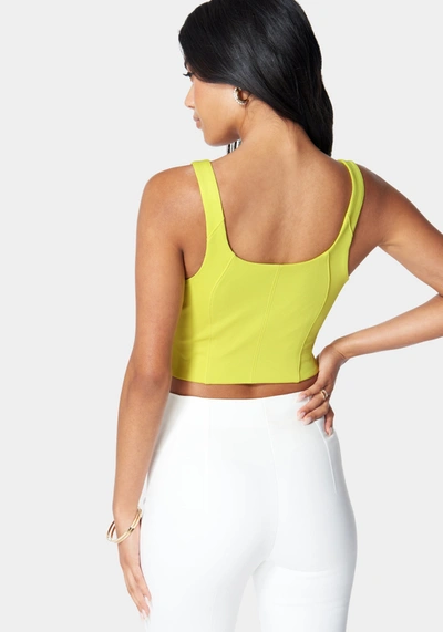 Bebe Sleeveless Front Zip Bustier Knit Top In Cyber Lime