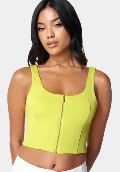 Bebe Sleeveless Front Zip Bustier Knit Top In Cyber Lime