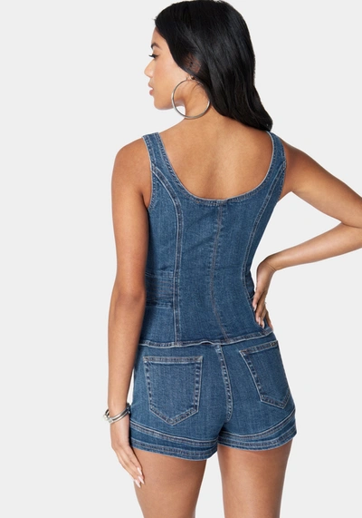 Bebe Zip Front Peplum Denim Top In True Blue Wash