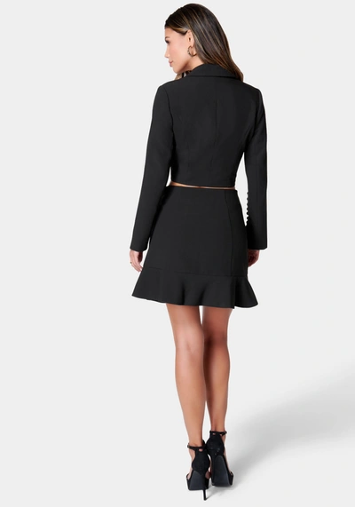 Shop Bebe Tailored Flounce Mini Skirt In Black