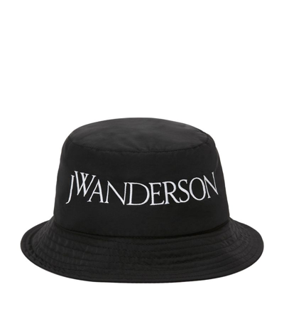 Shop Jw Anderson Logo-embroidered Bucket Hat In Black