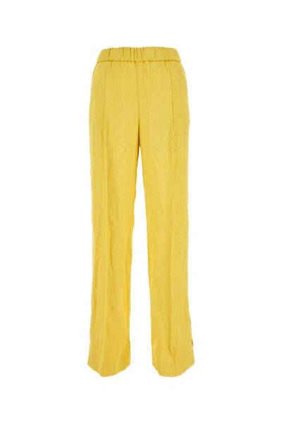 Shop Jil Sander Pants In Yellow