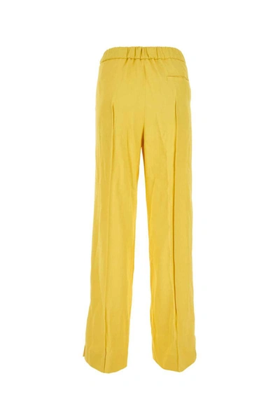 Shop Jil Sander Pants In Yellow