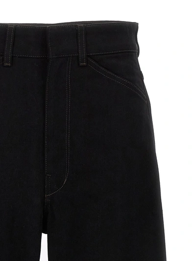 Shop Lemaire 'curved' Jeans In Black