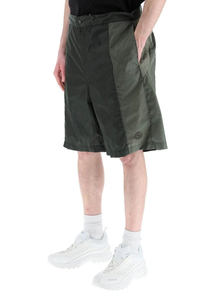 Shop Moncler Born To Protect Perforated Nylon Shorts In Green