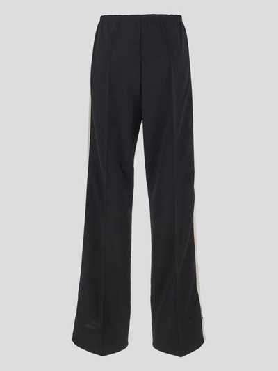 Shop Palm Angels Trousers In Blackoffwhite
