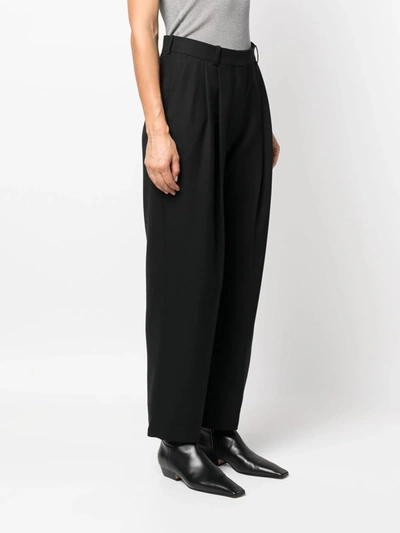 Shop Totême Pants In Black