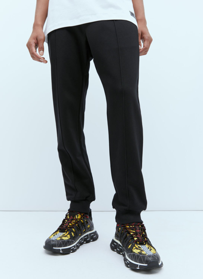 Shop Versace Logo Embroidery Track Pants In Black