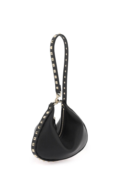 Shop Valentino Rockstud Mini Hobo Bag In Black