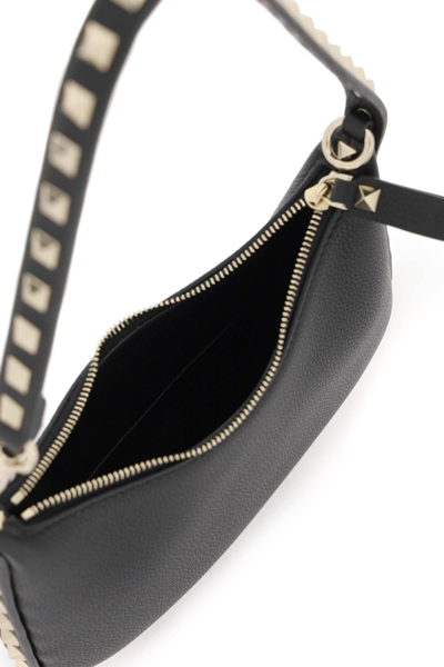 Shop Valentino Rockstud Mini Hobo Bag In Black