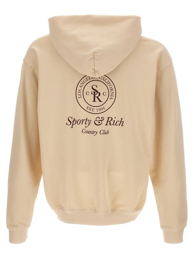 Shop Sporty And Rich Printed Hoodie Sweatshirt Beige