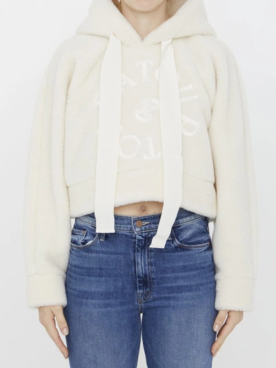 Shop Patou Cropped Medallion Logo Hoodie In Ivory