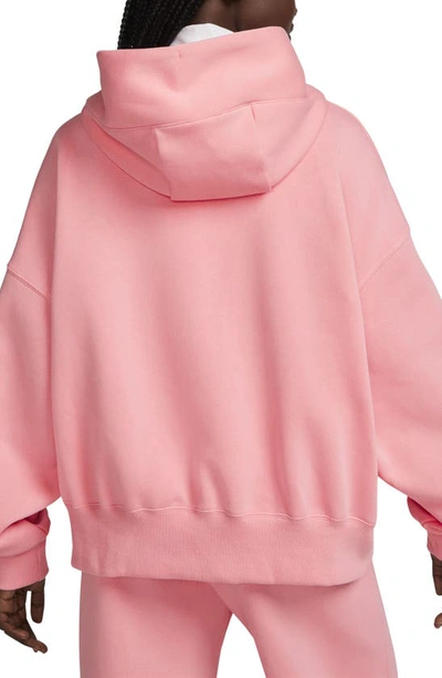 Shop Nike Sportswear Phoenix Fleece Pullover Hoodie In Coral Chalk/ Sail