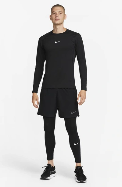 Shop Nike Pro Warm Dri-fit Tights In Black/ White