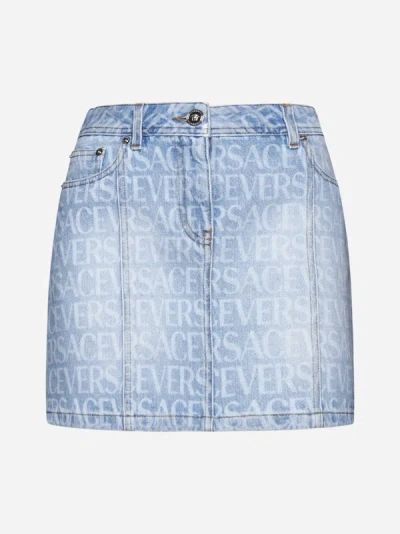 Shop Versace All-over Logo Denim Miniskirt In Light Blue