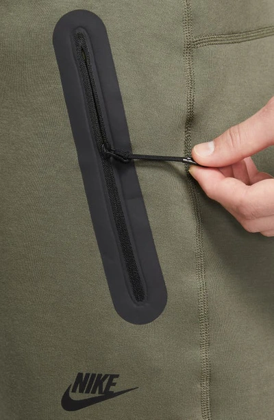 Shop Nike Tech Fleece Open Hem Pants In Medium Olive/ Black