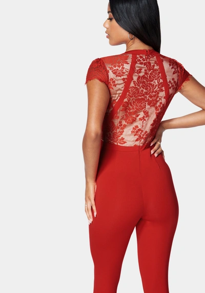 Shop Bebe Caged Lace Catsuit In Red