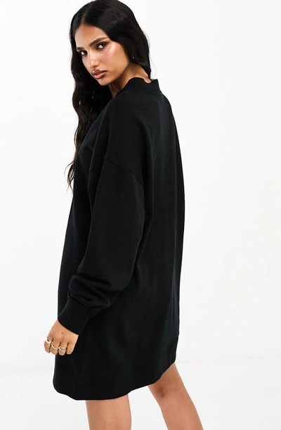 Shop Asos Design Long Sleeve Sweatshirt Dress In Black