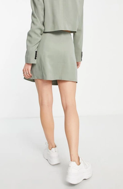 Shop Topshop Button Wrap Miniskirt In Sage