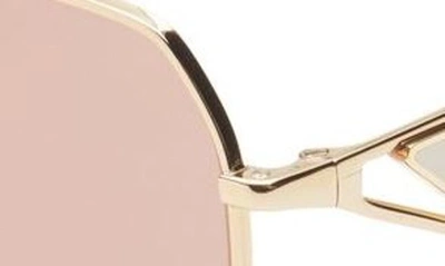 Shop Prada 57mm Irregular Sunglasses In Gold