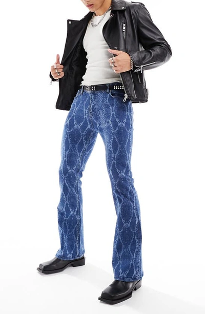 Shop Asos Design Snakeskin Print Stretch Flare Leg Jeans In Mid Blue