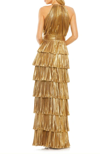 Shop Mac Duggal Pleated Metallic Halter Gown In Gold