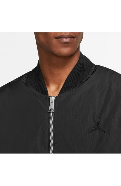 Shop Jordan Essentials Renegade Water Repellent Bomber Jacket In Black/ Black