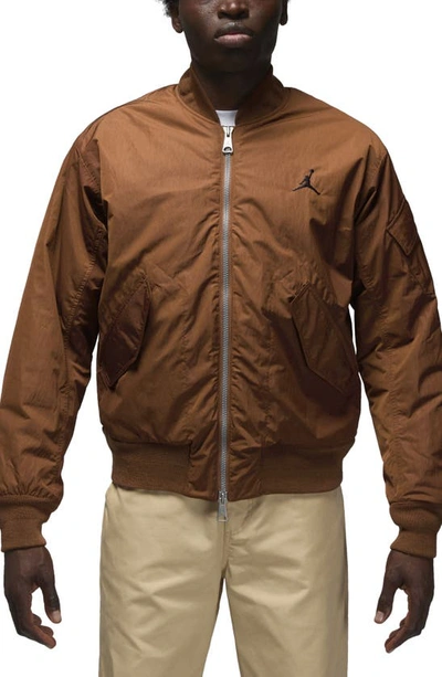 Shop Jordan Essentials Renegade Water Repellent Bomber Jacket In Light British Tan/ Black