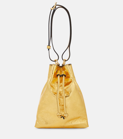 Shop Khaite Greta Small Metallic Shoulder Bag In Gold