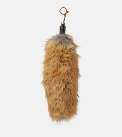 Shop Burberry Faux-fur Bag Charm In Brown