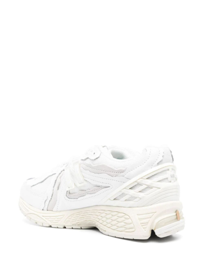 Shop New Balance 1906  Lifestyle Sneakers In White