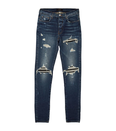 Shop Amiri Distressed Slim Jeans In Blue