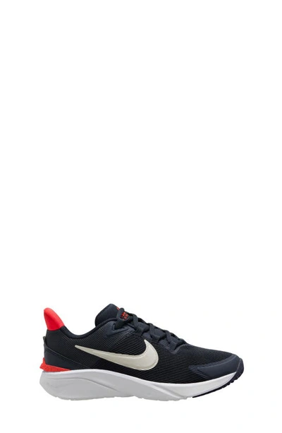 Shop Nike Kids' Star Runner 4 Sneaker In Obsidian/ Phantom/ Crimson