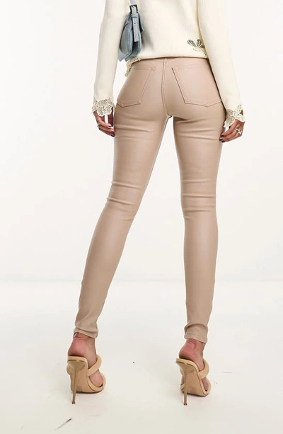 Shop Asos Design Coated Skinny Jeans In Stone