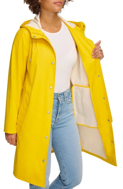 Shop Levi's Water Resistant Hooded Long Rain Jacket In Yellow