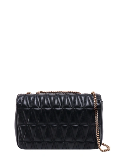 Shop Versace Matelassé Leather Shoulder Bag With V Baroque Detail