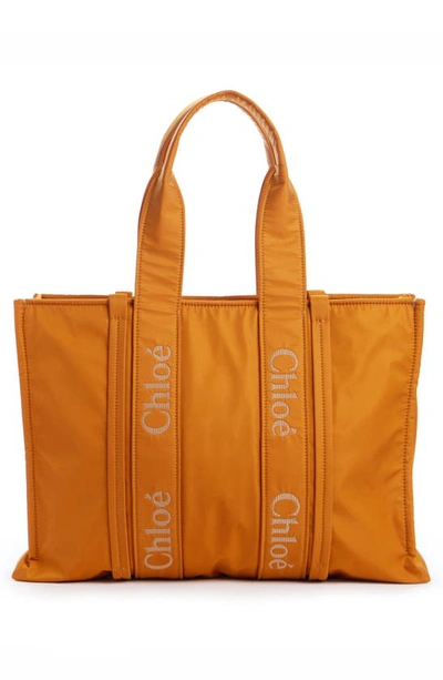 Shop Chloé Medium Woody Textile Tote In Golden Yellow 775